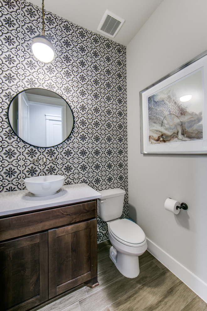 Powder room - mid-sized transitional cement tile porcelain tile powder room idea in Dallas with shaker cabinets, dark wood cabinets, a two-piece toilet, a vessel sink, quartz countertops, white countertops and a built-in vanity