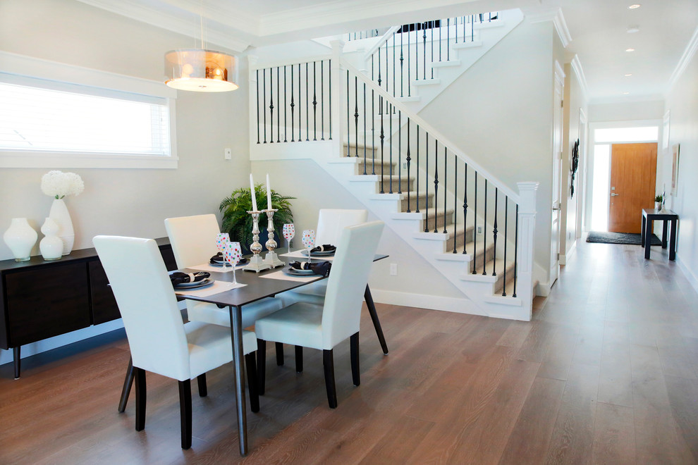 Mid-sized transitional dark wood floor and brown floor kitchen/dining room combo photo in Orange County with white walls