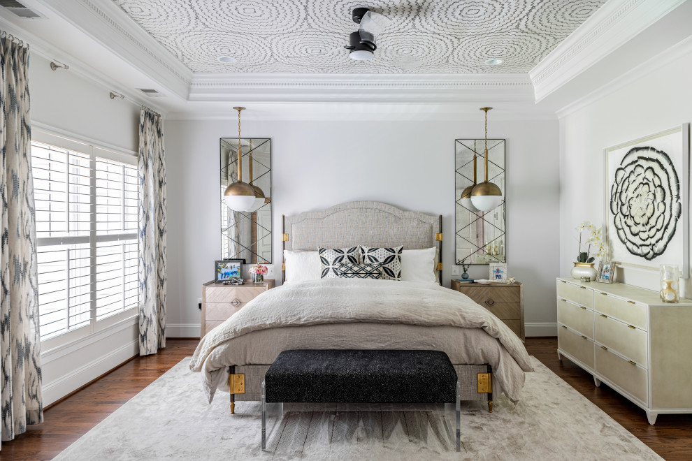 Inspiration for a mid-sized contemporary master bedroom in DC Metro with white walls, medium hardwood floors, brown floor and wallpaper.