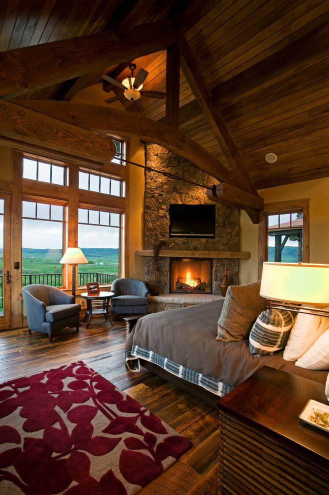 Inspiration for a traditional bedroom in Denver with a corner fireplace.