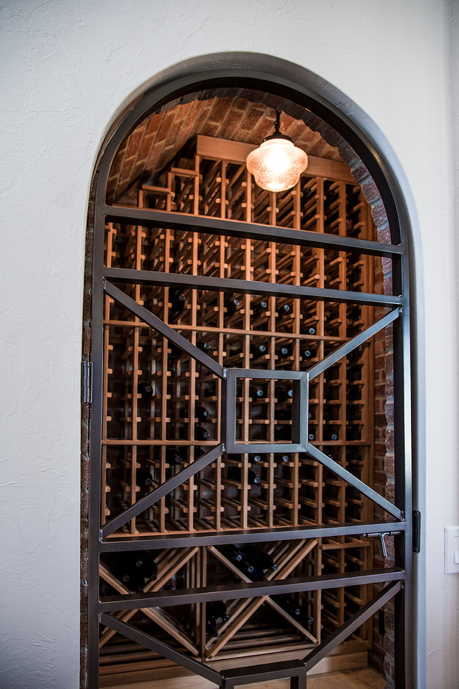 Design ideas for a mid-sized mediterranean wine cellar in Tampa.