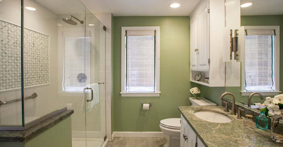 This is an example of a large traditional 3/4 bathroom in Boston with raised-panel cabinets, white cabinets, an open shower, green tile, white tile, porcelain tile, green walls, travertine floors, an undermount sink, granite benchtops and green benchtops.