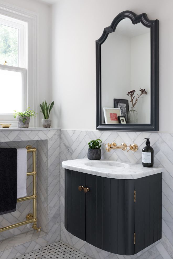 This is an example of a transitional bathroom in Surrey with flat-panel cabinets, black cabinets, white tile, white walls, mosaic tile floors, an undermount sink, white floor, white benchtops, a single vanity and a floating vanity.