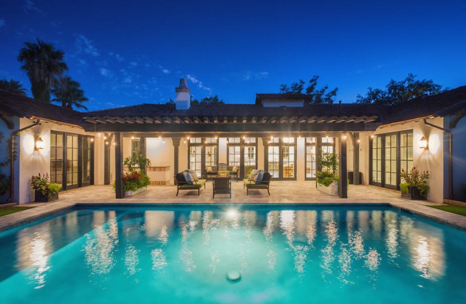 Transitional backyard pool photo in Phoenix