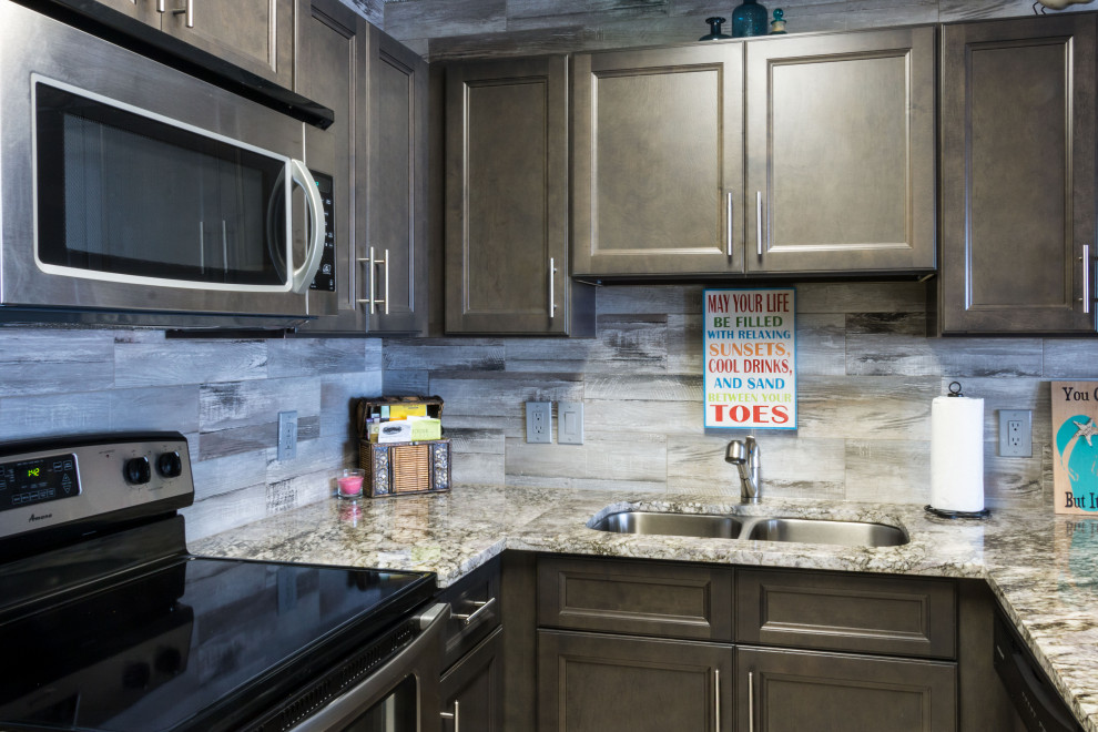 Inspiration for a small rustic u-shaped cement tile floor and beige floor eat-in kitchen remodel with an undermount sink, flat-panel cabinets, medium tone wood cabinets, granite countertops, gray backsplash, ceramic backsplash, stainless steel appliances, a peninsula and gray countertops