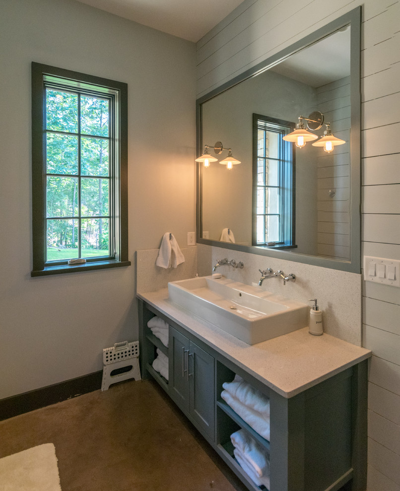 This is an example of a mid-sized country kids bathroom in Birmingham with shaker cabinets, green cabinets, an open shower, a one-piece toilet, gray tile, porcelain tile, green walls, concrete floors, a trough sink, engineered quartz benchtops, orange floor and a hinged shower door.