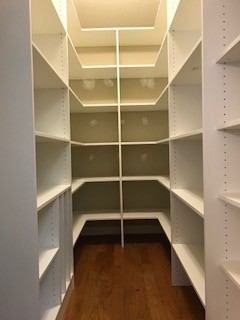 This is a walk-in pantry that is floor based with adjustable shelving to the top! Each shelf is large and wide for optimal storage needs! The bottom left has a tray divider section to store large cook