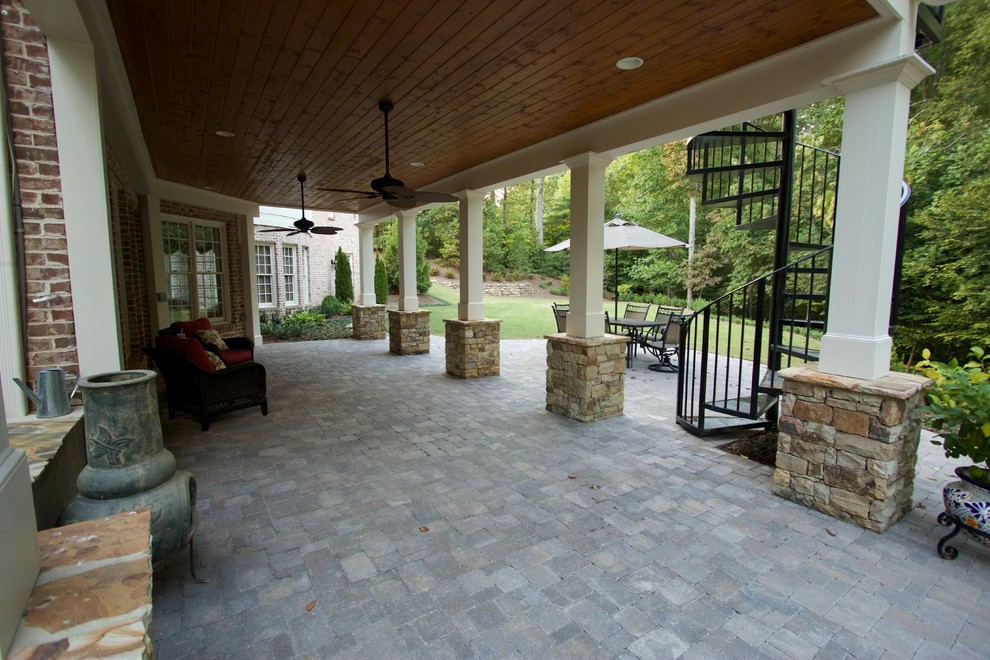 Gable screen porch with tile floor and spiral staircase Traditional