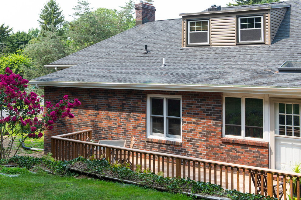 Inspiration for a small transitional backyard deck remodel with no cover