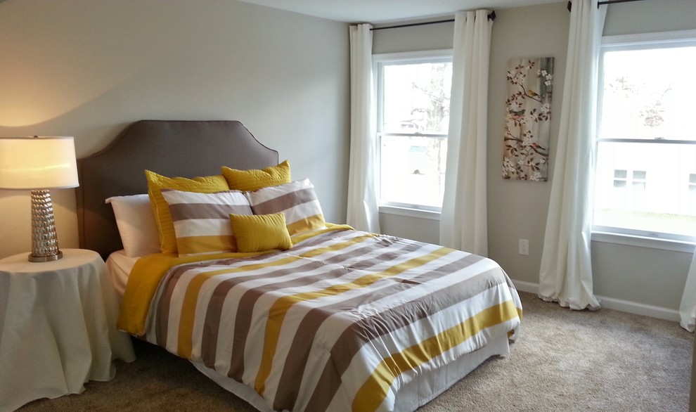 This is an example of a mid-sized contemporary master bedroom in Philadelphia with grey walls and carpet.