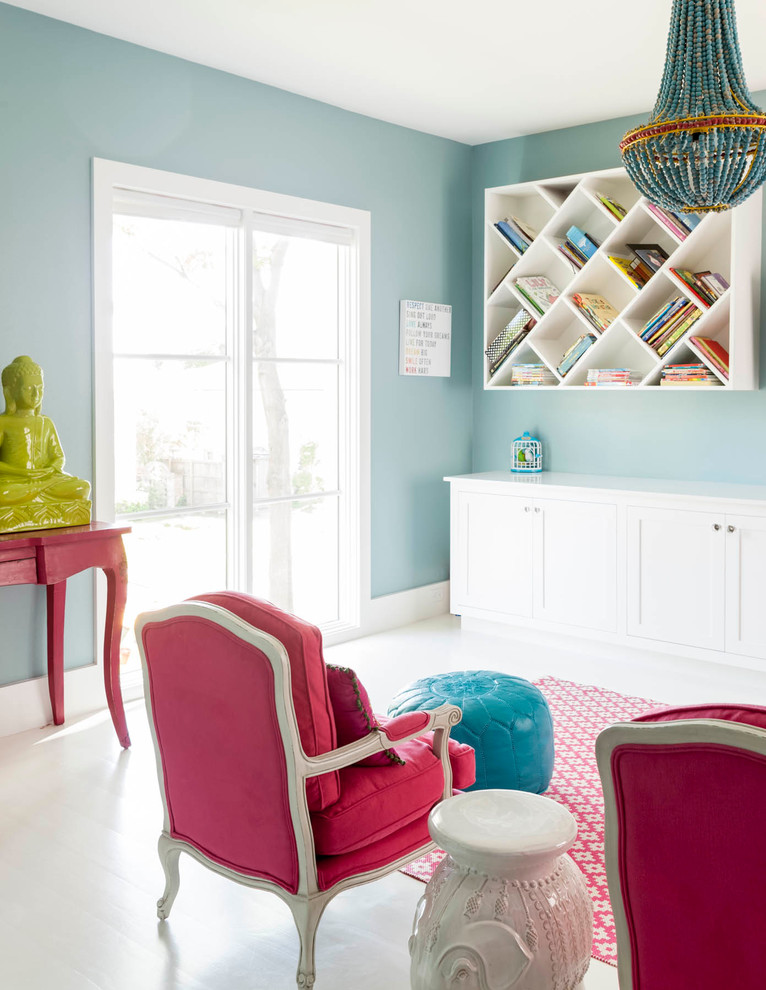 This is an example of an eclectic kids' playroom for girls in Dallas with blue walls and painted wood floors.