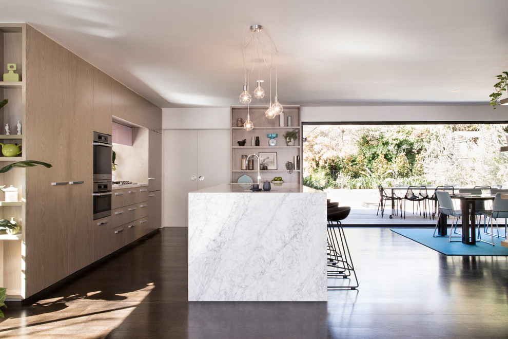 Design ideas for a contemporary kitchen in Melbourne with light wood cabinets, marble benchtops and dark hardwood floors.