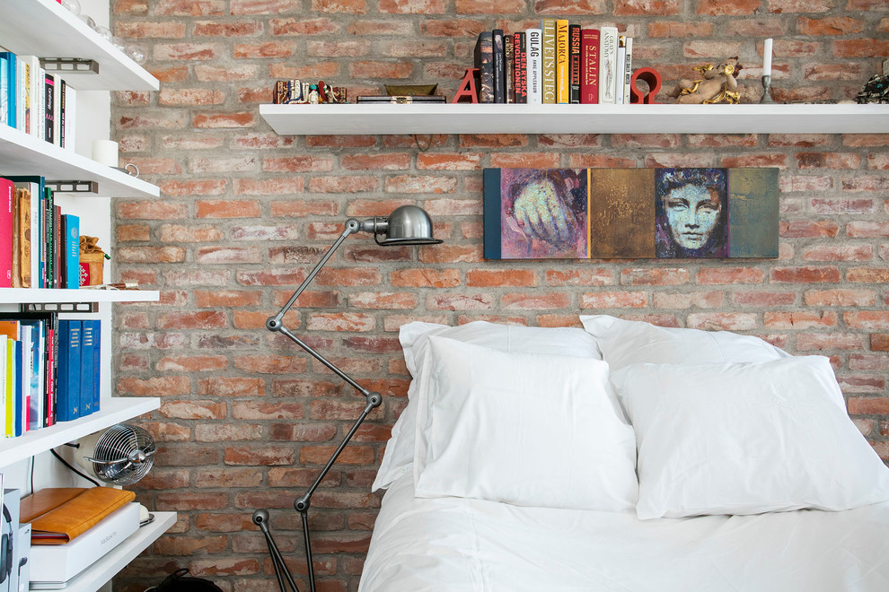 Inspiration for a small eclectic bedroom in Malmo with orange walls.