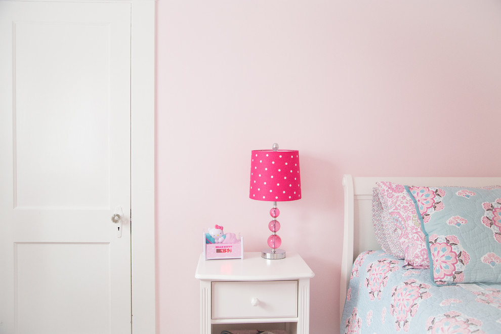 Design ideas for a mid-sized traditional kids' bedroom for kids 4-10 years old and girls in Boston with pink walls.