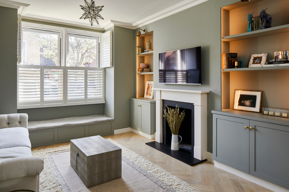 Design ideas for a transitional family room in London.