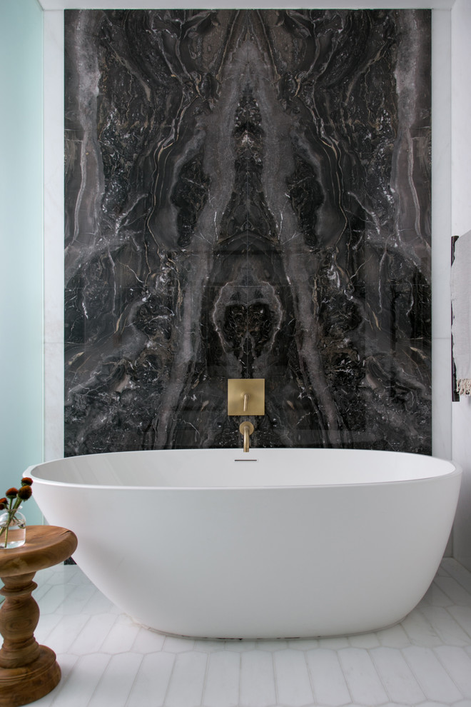 Inspiration for a large transitional master bathroom in New York with flat-panel cabinets, white cabinets, a freestanding tub, a double shower, a wall-mount toilet, beige tile, marble, white walls, marble floors, an undermount sink, onyx benchtops, beige floor and a hinged shower door.