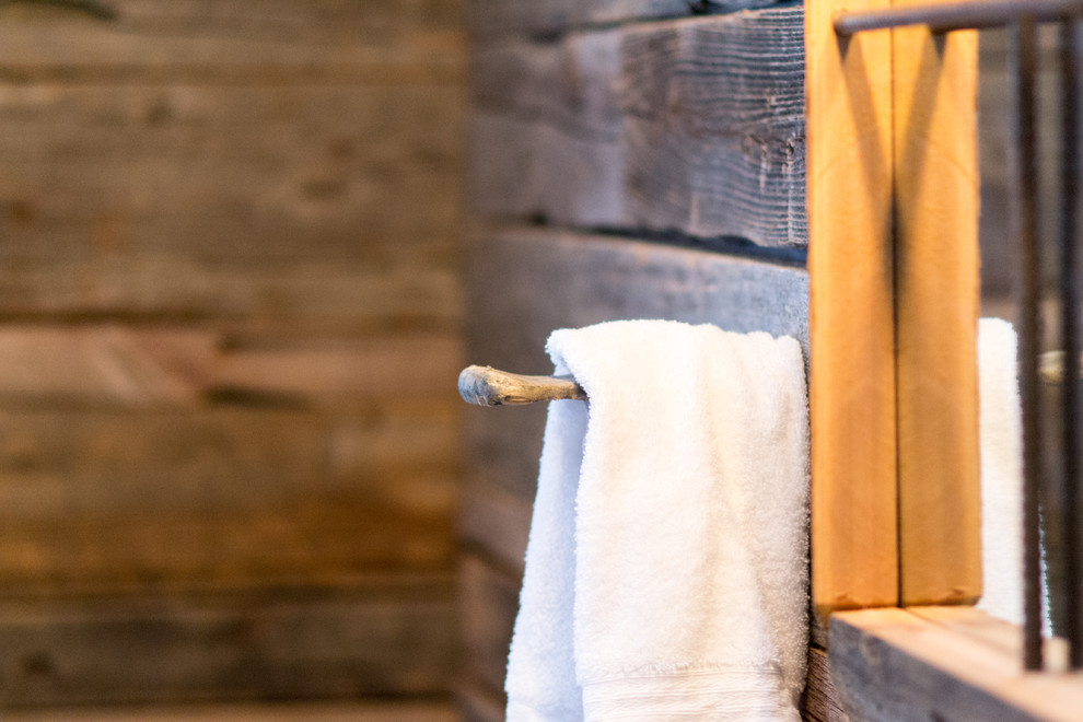 Inspiration for a rustic bathroom remodel in Toronto with wood countertops