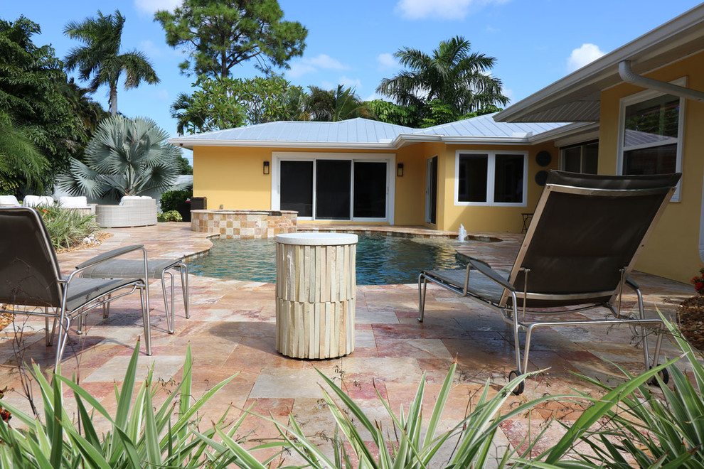 Inspiration for a large transitional backyard tile and custom-shaped hot tub remodel in Miami