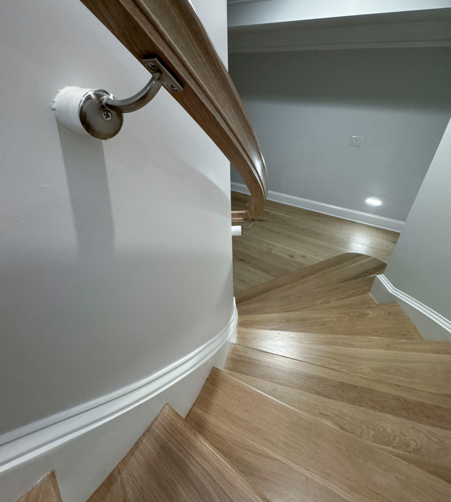 Inspiration for a large traditional wood floating staircase in DC Metro with painted wood risers and mixed railing.