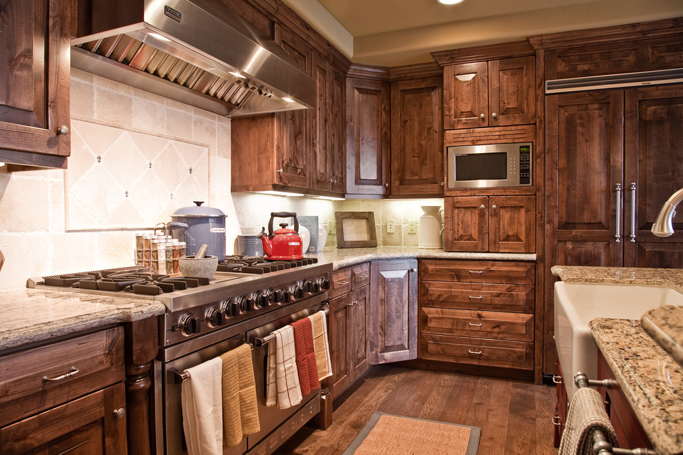 Photo of a traditional kitchen in Salt Lake City with panelled appliances and a farmhouse sink.