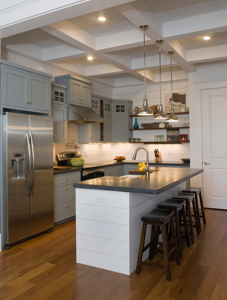 Design ideas for a traditional l-shaped kitchen in Raleigh with stainless steel appliances, a farmhouse sink, grey cabinets, concrete benchtops and shaker cabinets.
