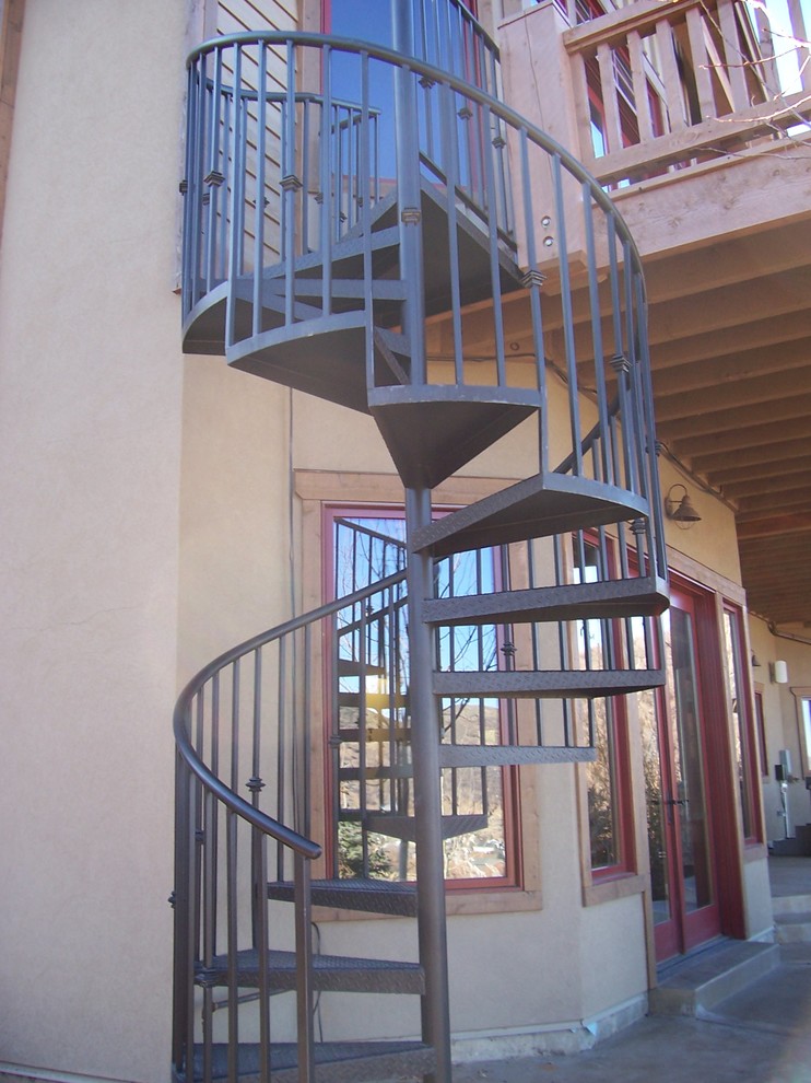 Inspiration for a mid-sized modern metal spiral staircase in Salt Lake City with open risers.