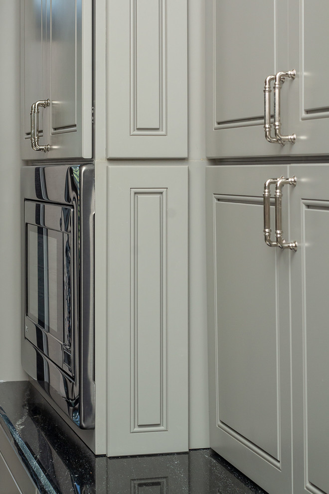Inspiration for a large transitional l-shaped porcelain tile and white floor eat-in kitchen remodel in Houston with a single-bowl sink, beaded inset cabinets, gray cabinets, granite countertops, white backsplash, marble backsplash, stainless steel appliances, two islands and black countertops