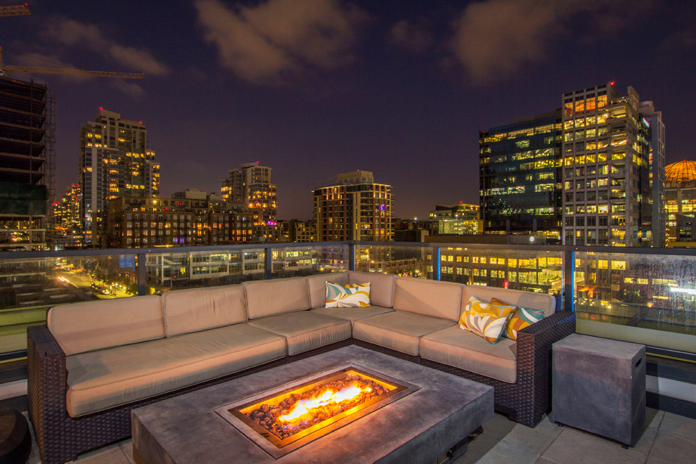Photo of a large contemporary rooftop deck in San Diego with a fire feature.