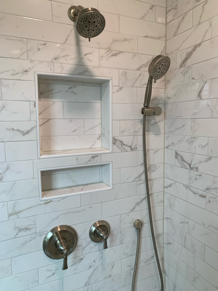 Alcove shower - large transitional master white tile and porcelain tile porcelain tile, gray floor and double-sink alcove shower idea in Cincinnati with recessed-panel cabinets, white cabinets, an undermount tub, a two-piece toilet, gray walls, an undermount sink, quartz countertops, a hinged shower door, white countertops and a built-in vanity
