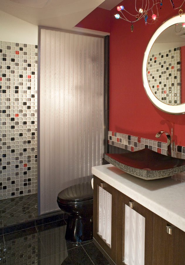Inspiration for a small contemporary bathroom in San Diego with a vessel sink, furniture-like cabinets, dark wood cabinets, quartzite benchtops, a one-piece toilet, multi-coloured tile, glass tile, red walls and marble floors.
