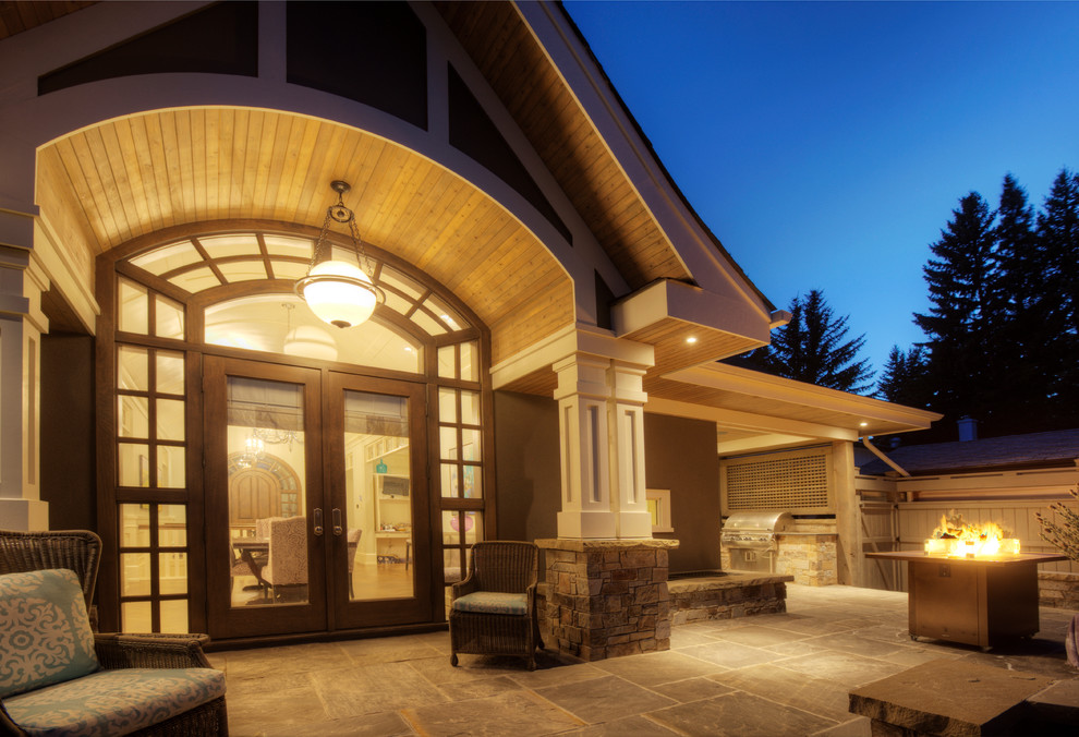 Large transitional blue one-story mixed siding exterior home photo in Calgary