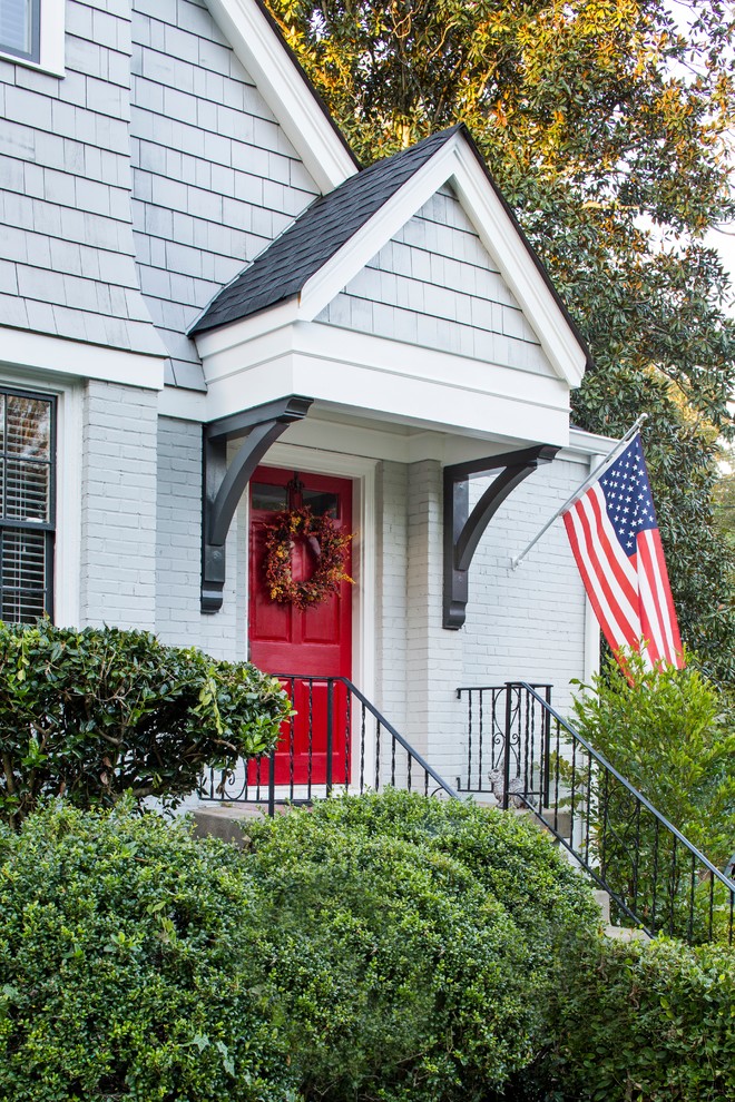 Front door - transitional front door idea in Atlanta with gray walls and a red front door
