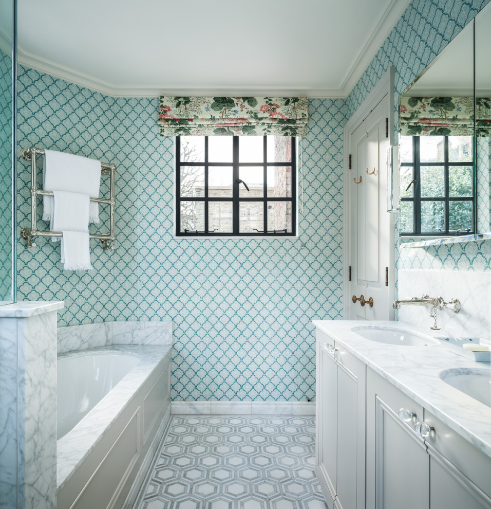 Design ideas for a mid-sized transitional master bathroom in Other with recessed-panel cabinets, white cabinets, an undermount tub, green walls, porcelain floors, an undermount sink, grey floor, grey benchtops, a double vanity, a built-in vanity and wallpaper.