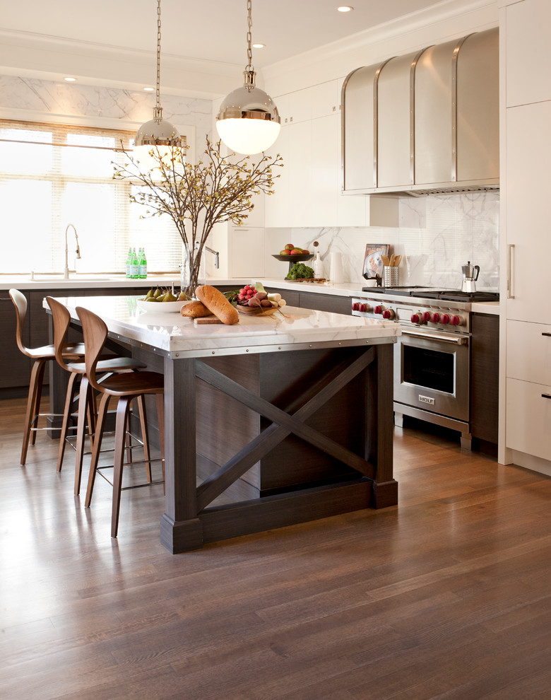 Inspiration for a transitional l-shaped dark wood floor kitchen remodel in Calgary with white cabinets, stainless steel appliances, an island, flat-panel cabinets and white backsplash