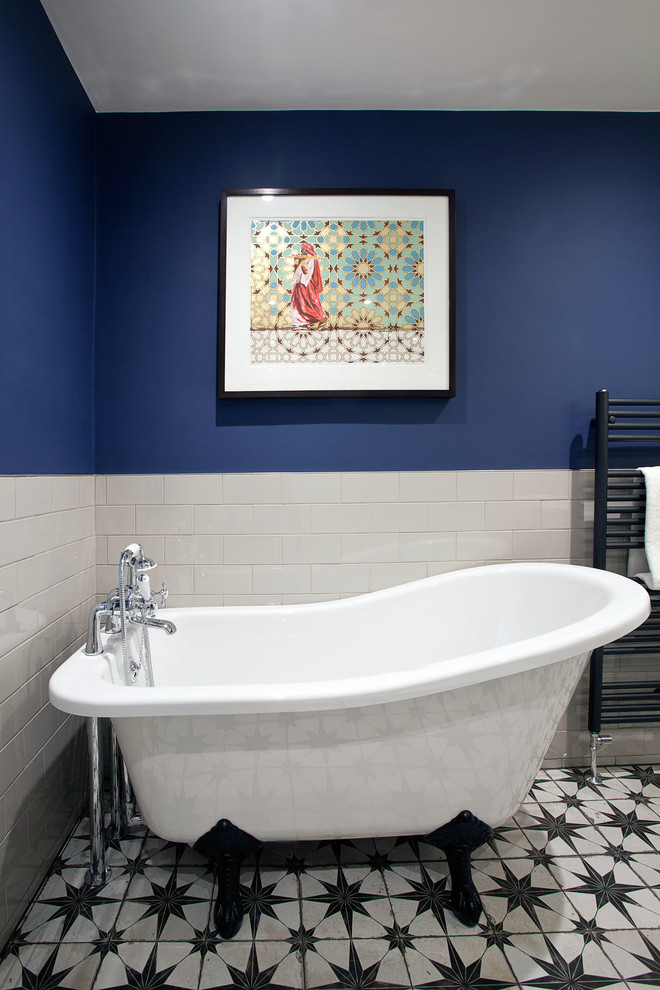 This is an example of a mid-sized transitional bathroom in Surrey with a freestanding tub, an open shower, white tile, blue walls, ceramic floors, multi-coloured floor, an open shower and subway tile.