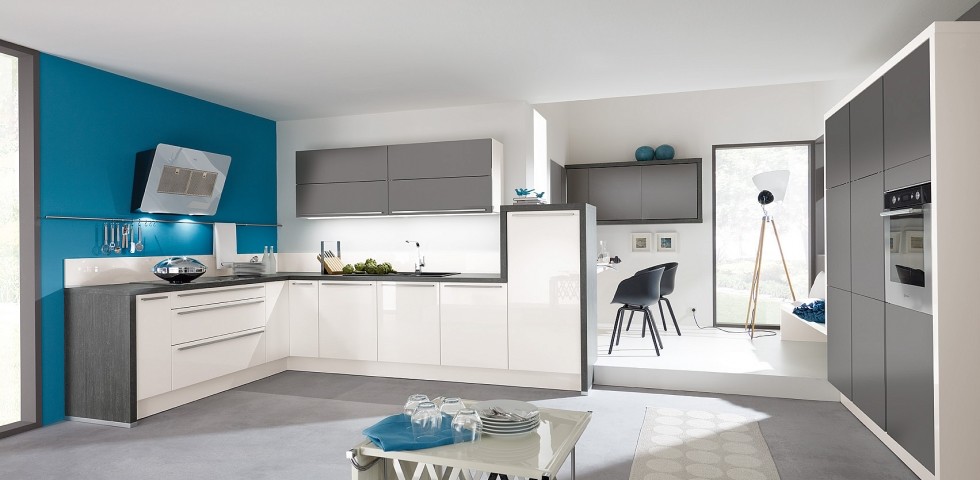 Mid-sized contemporary l-shaped eat-in kitchen in Other with a single-bowl sink, flat-panel cabinets, white cabinets, laminate benchtops, white splashback, glass tile splashback, panelled appliances, linoleum floors and no island.