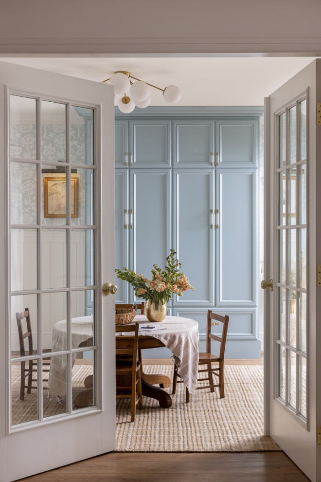 French-Country Robin's Egg Playroom - Country wainscoting playroom photo in Orange County with blue walls