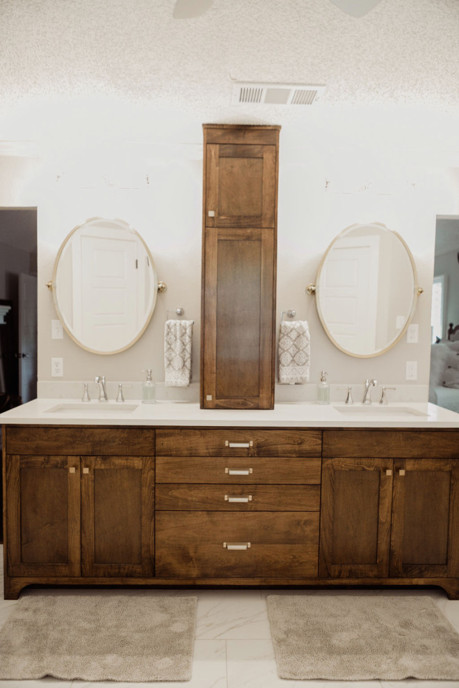 Example of a mid-sized minimalist master white tile porcelain tile and white floor freestanding bathtub design in Dallas with flat-panel cabinets, brown cabinets, white walls, quartzite countertops, a hinged shower door and white countertops