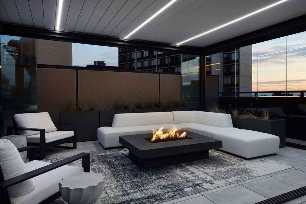 Minimalist rooftop rooftop deck photo in Chicago with a pergola and a fire pit