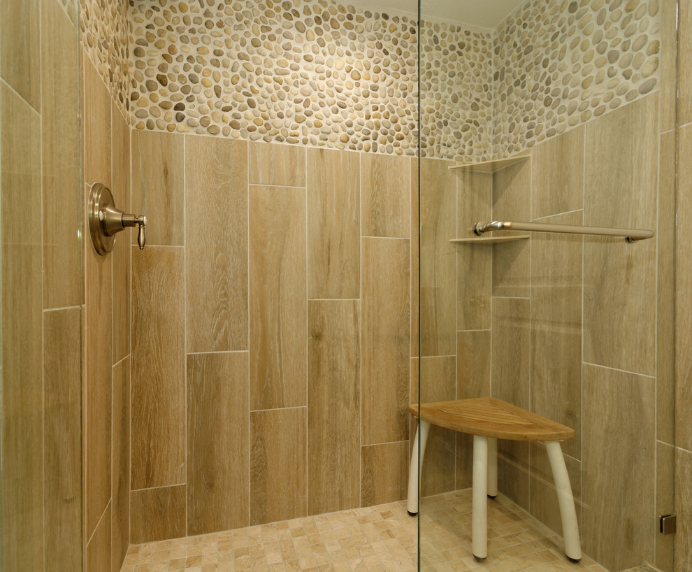 This is an example of a beach style master bathroom in Miami with an alcove shower, beige tile and ceramic tile.