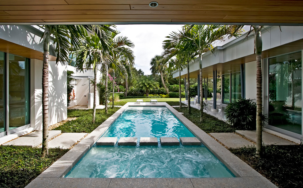 Inspiration for a contemporary courtyard rectangular pool in Miami.