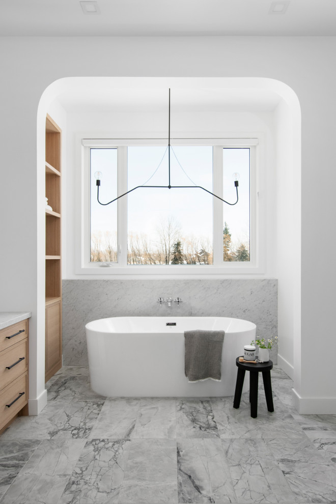 Classic bathroom in Other with shaker cabinets, black cabinets, a freestanding bath, a one-piece toilet, marble flooring, a submerged sink, marble worktops, grey floors, a hinged door, white worktops, double sinks and a built in vanity unit.