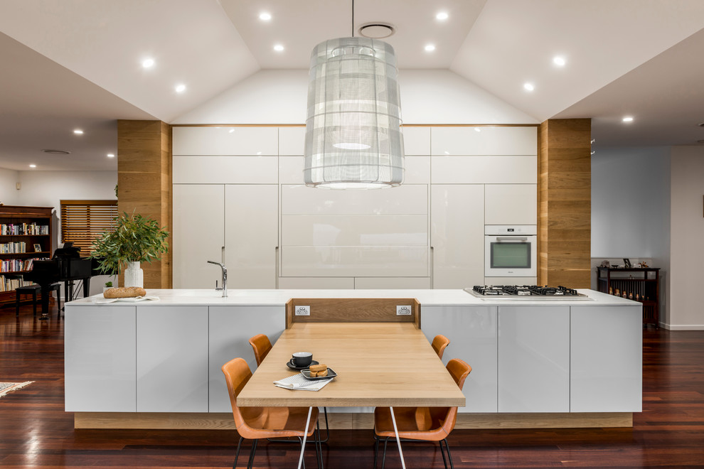 Design ideas for a scandinavian open plan dining in Brisbane with dark hardwood floors.