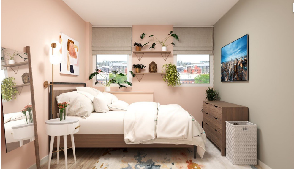 Modelo de dormitorio principal actual pequeño con paredes rosas, suelo de madera en tonos medios y suelo marrón