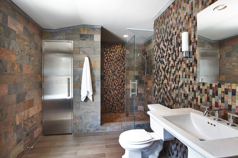 Inspiration for a small modern kids bathroom in New York with a pedestal sink, shaker cabinets, an alcove shower, a two-piece toilet, brown tile, stone tile, multi-coloured walls and porcelain floors.