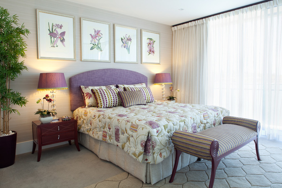 This is an example of a contemporary master bedroom in Brisbane with beige walls, carpet and no fireplace.