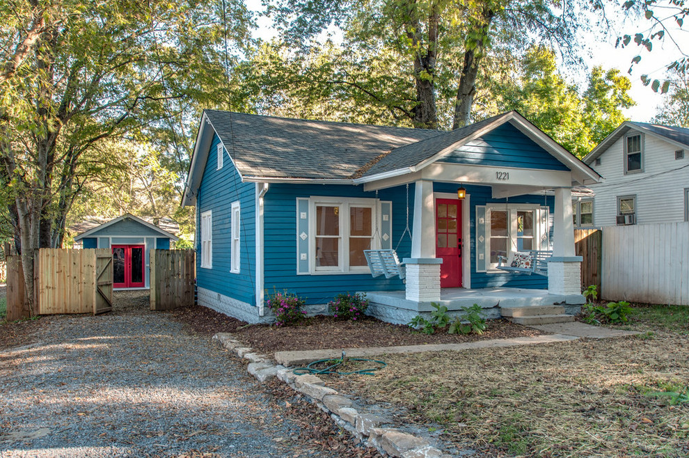 Photo of a small arts and crafts one-storey blue exterior in Nashville with wood siding and a gable roof.