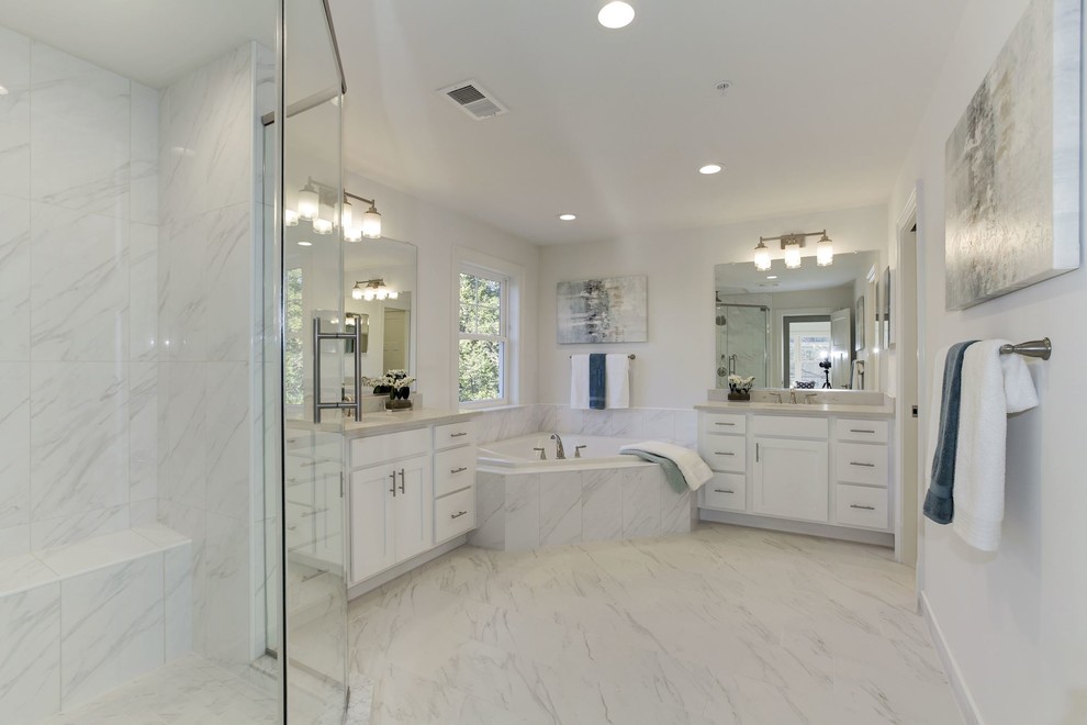 Example of a mid-sized transitional master white tile and porcelain tile corner bathtub design in DC Metro with shaker cabinets, white walls and quartz countertops