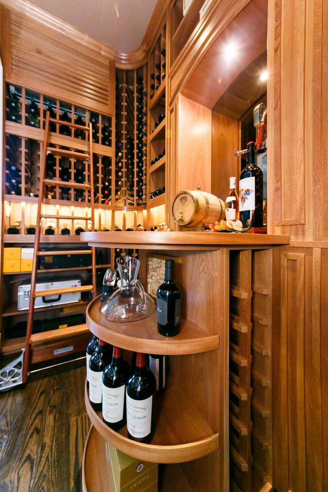 Small elegant dark wood floor wine cellar photo in New York
