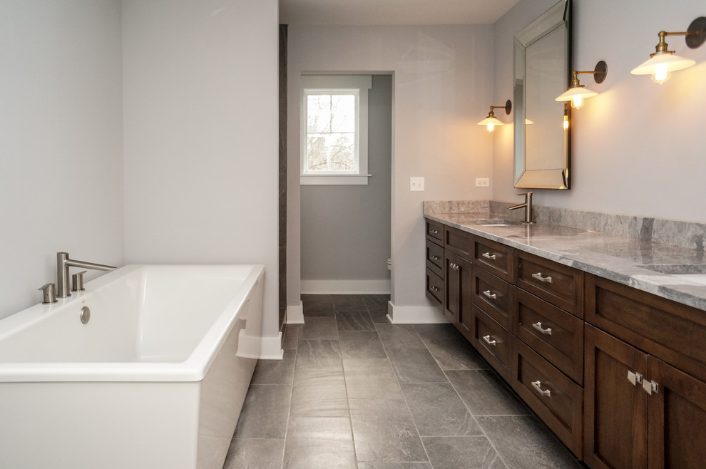 Inspiration for an arts and crafts bathroom in Chicago with medium wood cabinets, a freestanding tub, gray tile, grey walls, dark hardwood floors, a pedestal sink, granite benchtops and with a sauna.